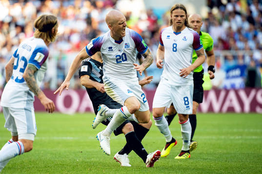 Emil Hallfredsson of Iceland and Javier Mascherano of