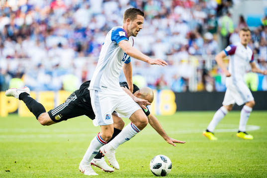 Gylfi Sigurdsson of Iceland in action with Javier
