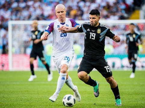 Emil Hallfredsson of Iceland and Sergio Aguero of Argentina