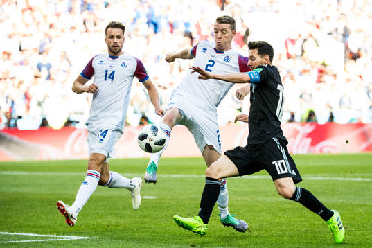 Lionel Messi of Argentina against Kari Arnason and Birkir
