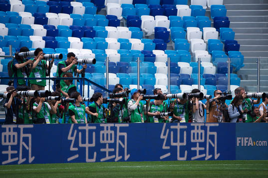 Photographers covering the Swedish national football team's