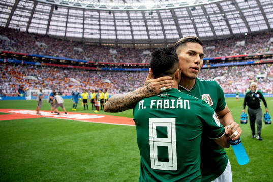 Carlos Salcedo and Marco Fabian of Mexico