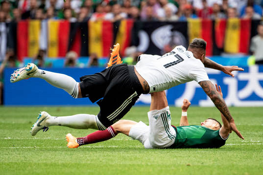 Jerome Boateng of Germany and Javier Hernandez of Mexico
