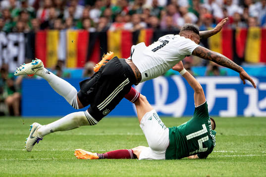 Jerome Boateng of Germany and Javier Hernandez of Mexico
