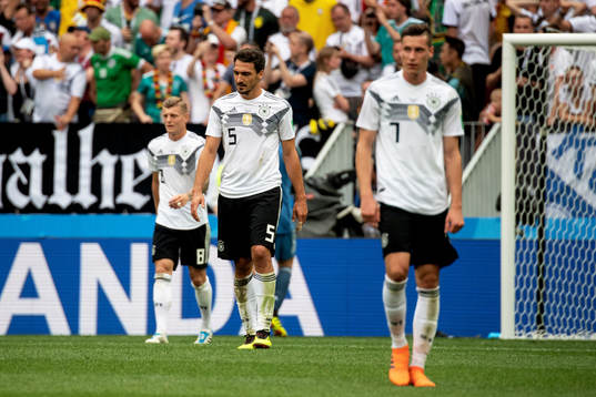 Mats Hummels and Julian Draxler of Germany looks dejected