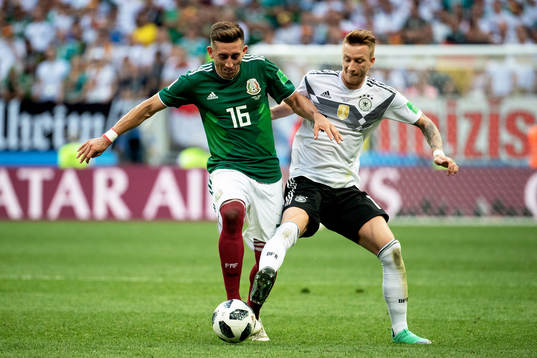 Hector Herrera of Mexico and Marco Reus of Germany