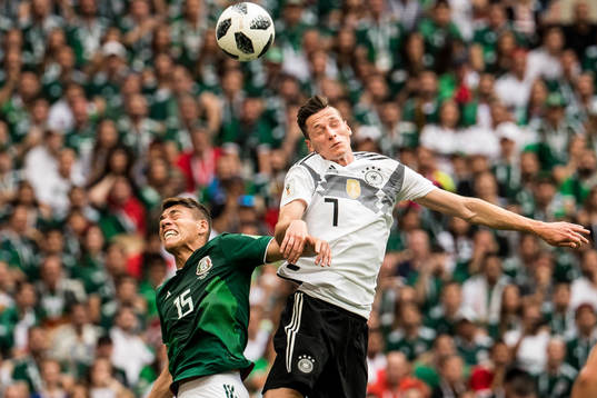 Hector Moreno of Mexico and Julian Draxler of Germany