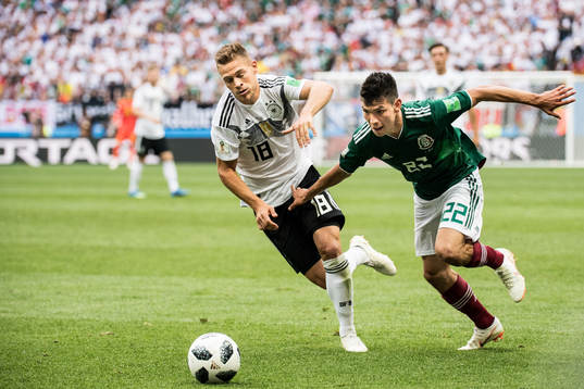 Joshua Kimmich of Germany and Hirving Lozano of Mexico