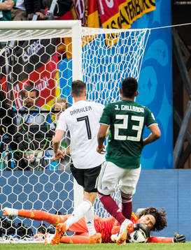 Goalkeeper Guillermo Ochoa of Mexico saves from Julian
