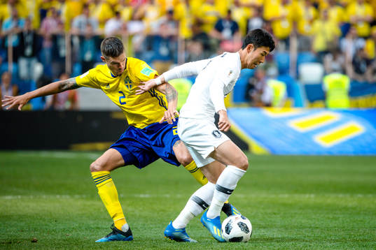 Mikael Lustig of Sweden and Heungmin Son of South Korea