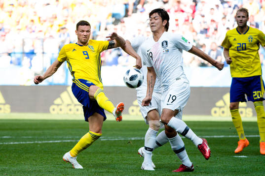 Marcus Berg of Sweden against Sungyueng Ki and Younggwon