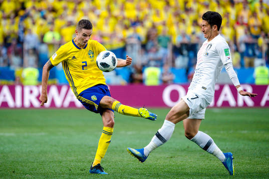 Mikael Lustig of Sweden and Heungmin Son Heungmin Son