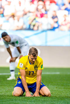 Viktor Claesson of Sweden looks dejected