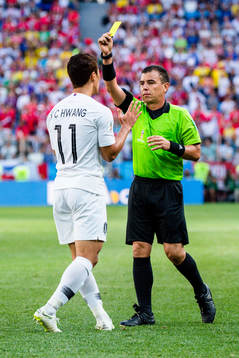 Heechan Hwang of South Korea and Referee Joel Aguilar