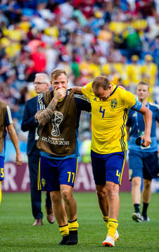 John Guidetti and Andreas Granqvist of Sweden celebrates