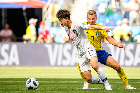 Jaesung Lee of South Korea and Sebastian Larsson of Sweden