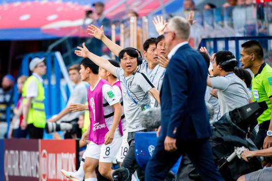 Players and staff of South Korea reacts