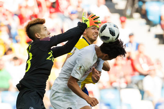 Goalkeeper Hyeonwoo Jo and Jacheol Koo of South Korea in a