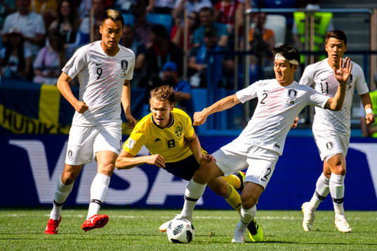 Albin Ekdal Albin Ekdal  and Yong Lee of South Korea
