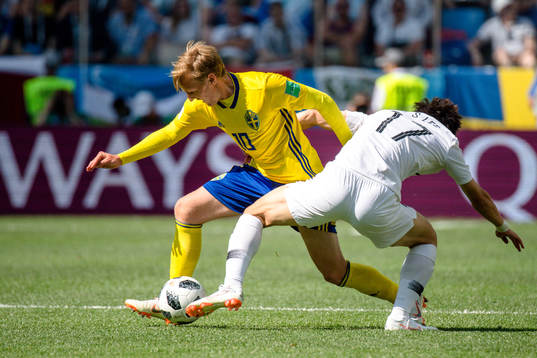 Emil Forsberg of Sweden and Jaesung Lee of South Korea