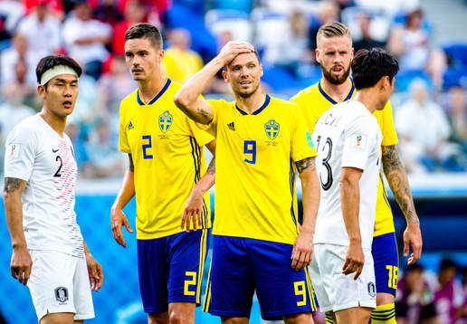 Mikael Lustig and Marcus Berg of Sweden looks dejected
