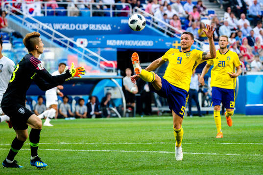 goalkeeper Hyeonwoo Jo of South Korea and Marcus Berg of