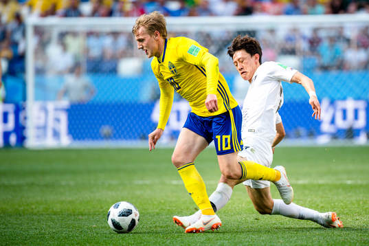 Emil Forsberg of Sweden and Jaesung Lee of South Korea