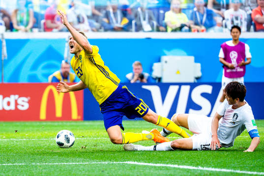Sungyueng Ki of South Korea against Ola Toivonen of Sweden
