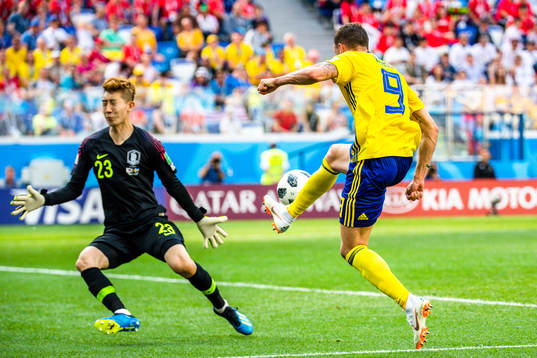 goalkeeper Hyeonwoo Jo of South Korea and Marcus Berg of
