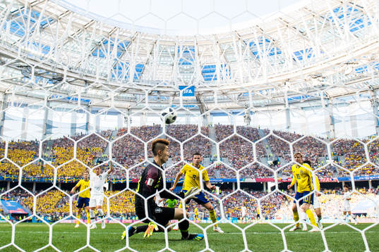 Marcus Berg of Sweden in action against goalkeeper Hyeonwoo