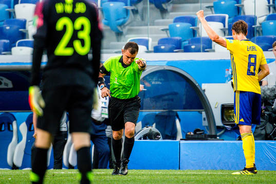 Referee Joel Aguilar reviews a penalty incident using VAR