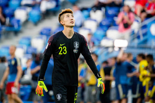 goalkeeper Hyeonwoo Jo of South Korea looks dejected