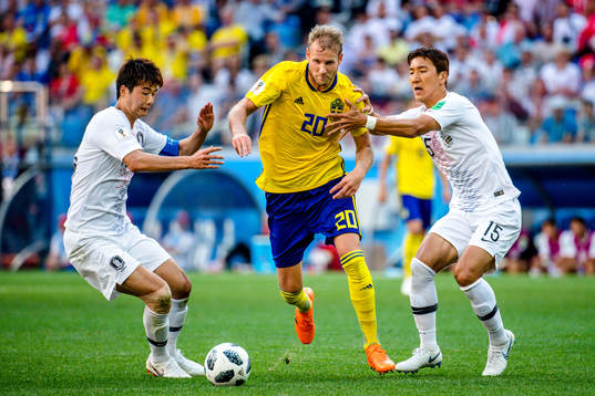 Ola Toivonen of Sweden and Wooyoung Jung of South Korea