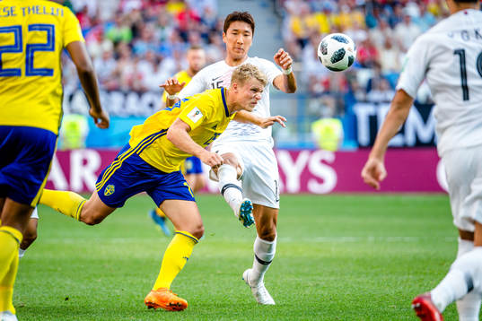 Oscar Hiljemark of Sweden and Wooyoung Jung of South Korea