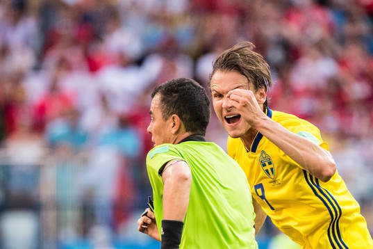 Albin Ekdal of Sweden reacts towards referee Joel Aguilar