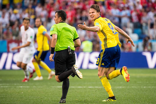 Albin Ekdal of Sweden reacts towards referee Joel Aguilar