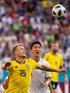 Oscar Hiljemark of Sweden and Wooyoung Jung of South Korea