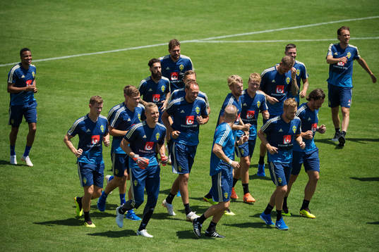 Players of the Swedish national football team warm up at a