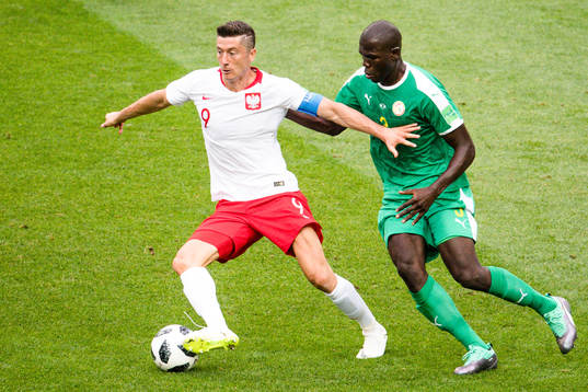 Robert Lewandowski of Poland and Kalidou Koulibaly of