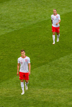 Kamil Grosicki and Arkadiusz Milik looks dejected at