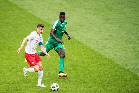 Robert Lewandowski of Poland and Alfred Ndiaye of Senegal