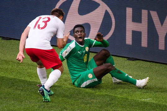 Maciej Rybus of Poland and Ismaila Sarr of Senegal