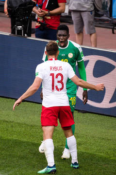 Maciej Rybus of Poland and Ismaila Sarr of Senegal