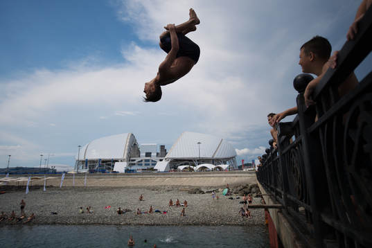 Kids jumping into the water