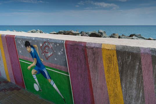 A mural with a football player