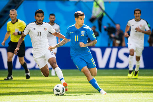 Johan Venegas of Costa Rica and Philippe Coutinho of Brazil