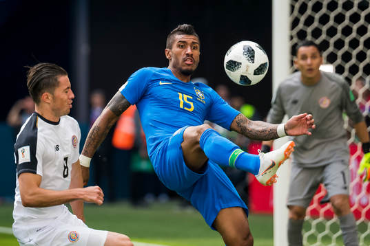 Bryan Oviedo of Costa Rica and Paulinho of Brazil