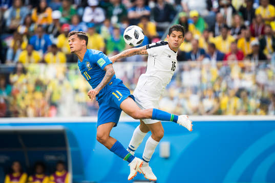 Philippe Coutinho of Brazil and Cristian Gamboa of Costa