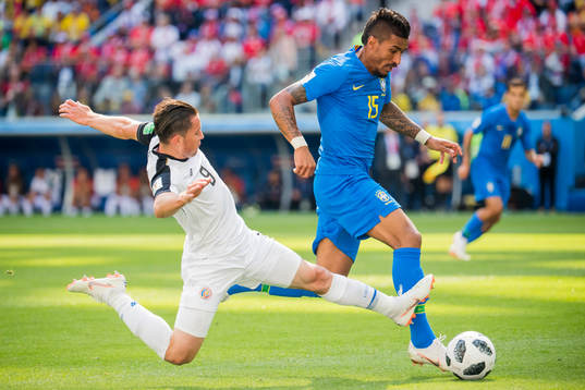 Bryan Oviedo of Costa Rica and Paulinho of Brazil