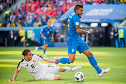 Bryan Oviedo of Costa Rica and Paulinho of Brazil